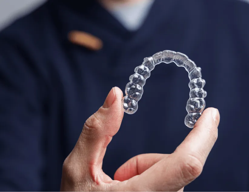Holding a clear aligner tray